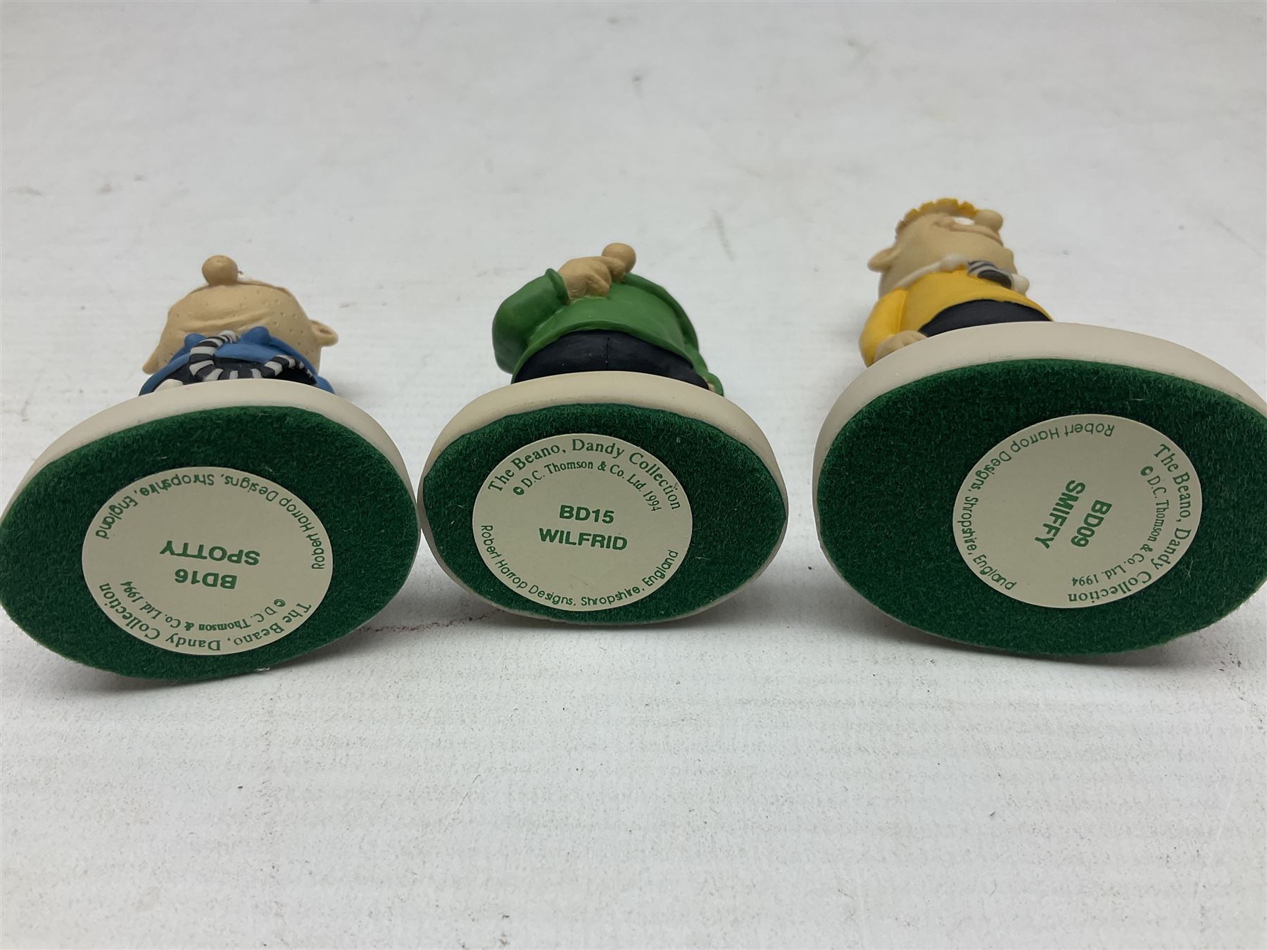 Fourteen Robert Harrop figures from the Beano Dandy collection, comprising Minnie the Minx BD04, Danny BD10, Biffo the Bear BD19, Spotty BD16, Smiffy BD09, Oops! BDS01, Little Plum BD27, Wilfrid BD15, Danny BD10, Winston BD17, 'Erbert BD14, Gnasher BD02, Beryl the Peril BD05 and Desperate Dan BD03, all with boxes