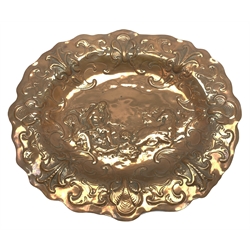 Large Newlyn School oval copper wall plaque, the dished centre embossed with a study of Neptune riding the waves, within a scrolling border with wavy rim, W48cm, H42cm