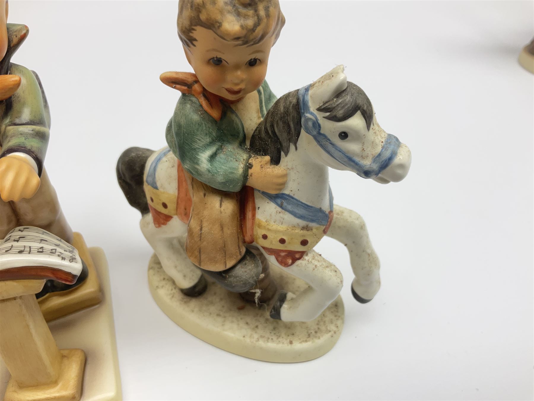 Twenty six Hummel figures by Goebel, to include Fire Fighter, Band Leader and Spring Sowing