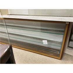 Six shelved cabinets for displaying ‘00’ gauge locomotives comprising plain plywood and white painted examples with track applied to various shelves, largest H63cm, W107cm, D27cm; Collection of tools for building model locomotives to include Weller PU-2D Soldering Pencil and Standard Tip Soldering Iron 20W/230V, Humbrol Modellers Airbrush, Power Supply Units and two wooden chests one of which housing a collection of tools including tweezers, scalping tools, wrenches etc 