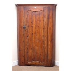  Early 20th century large pine floor standing corner cupboard, moulded cornice, single door enclosing three shelves, W113cm, H170cm, D46cm  