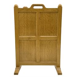 ‘Mouseman’ oak four panel firescreen, the cresting rail with handle and mouse signature, on sledge supports, by Robert Thompson of Kilburn 