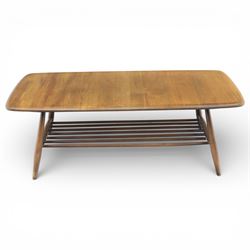 Ercol - Dark elm coffee table, plank top with chamfered edges, over a central under tier spindles, tapered legs 