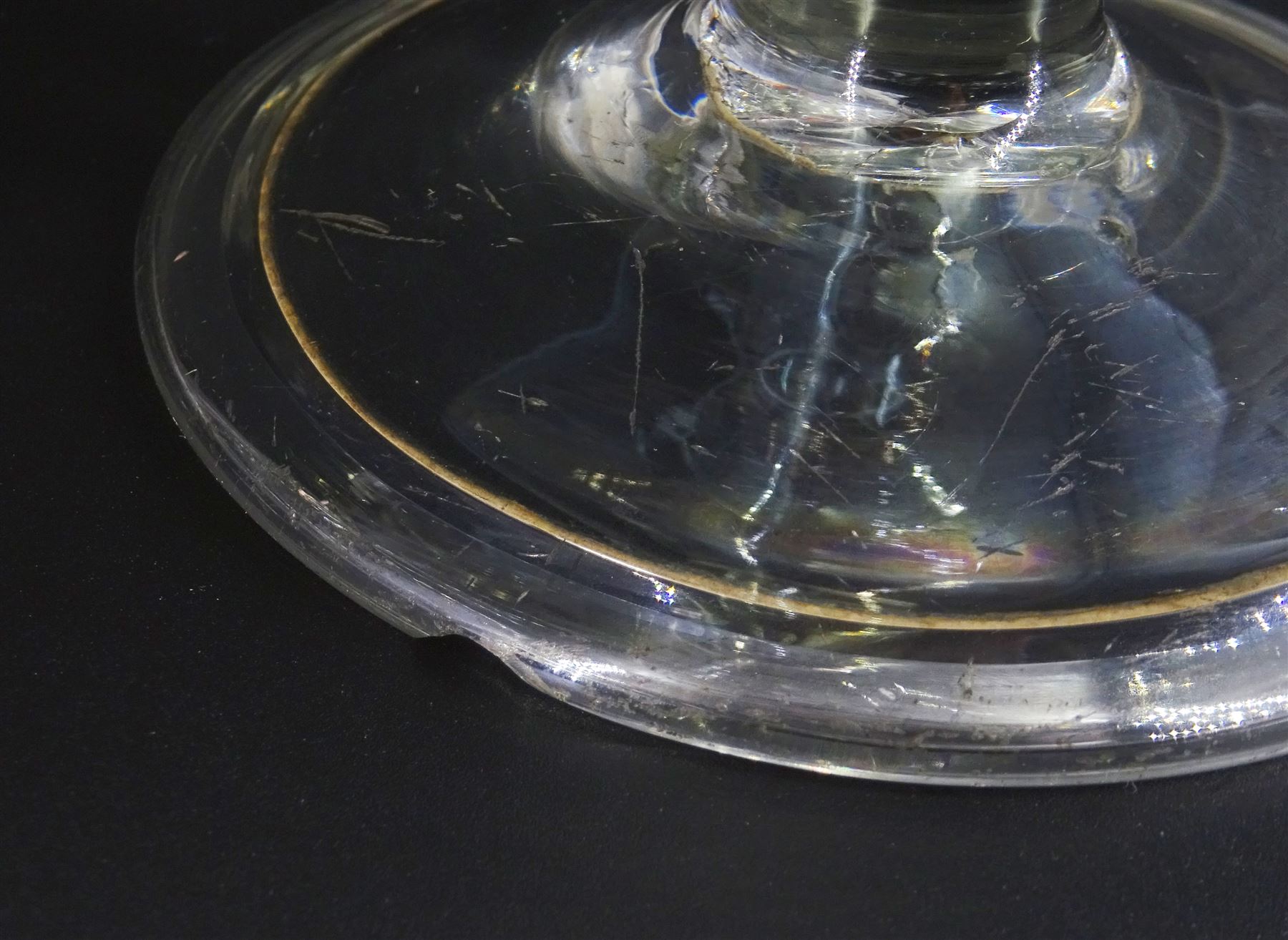 Two 18th century drinking glasses, the drawn trumpet bowls upon stems with internal tears, one elongated, and folded conical feet, largest H18cm