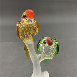 Three Swarovski Crystal bird figures, comprising Toucan, pair of puffins and pair of parrots on a branch, tallest H10cm