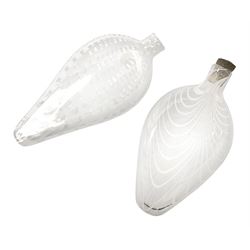 19th century Nailsea glass flask of compressed ovoid form, the clear body with opaque white combed decoration, H21cm, together with another similar example decorated with enamelled stylised bands, H23cm