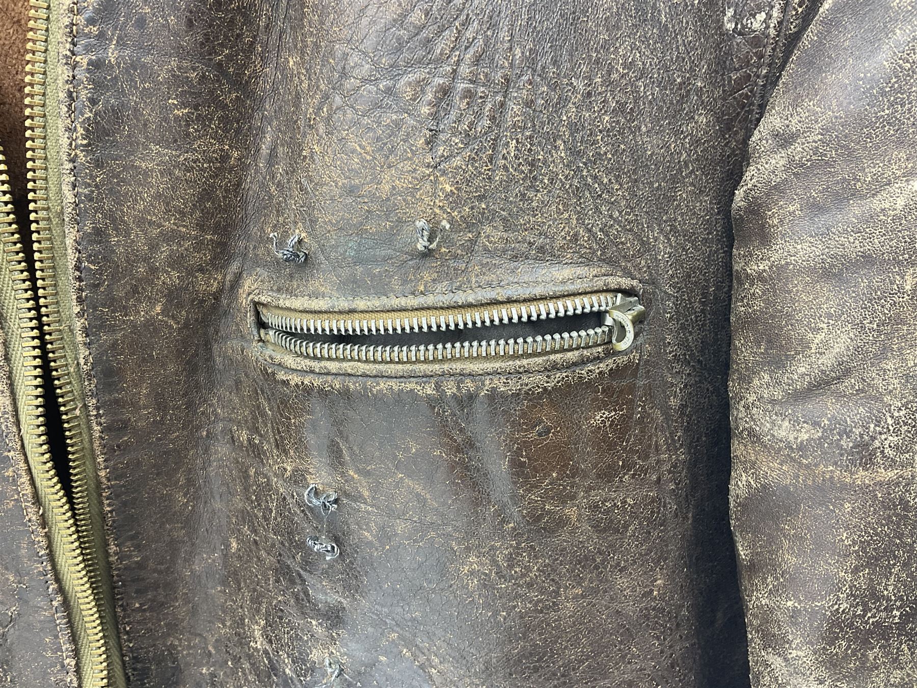 German Luftwaffe Hartmann leather jacket with tartan pocket linings, pocket zip pulls marked 'Eclair Bte.S.G.D.G.'