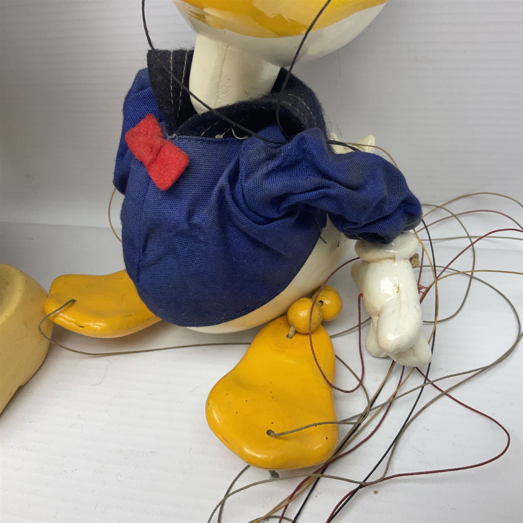 Two Pelham Puppets - The Magic Roundabout Mr. Rusty pole puppet with wool hands and blue  coat dated 1963; boxed; and Type SL Disney Donald Duck; unboxed (2)