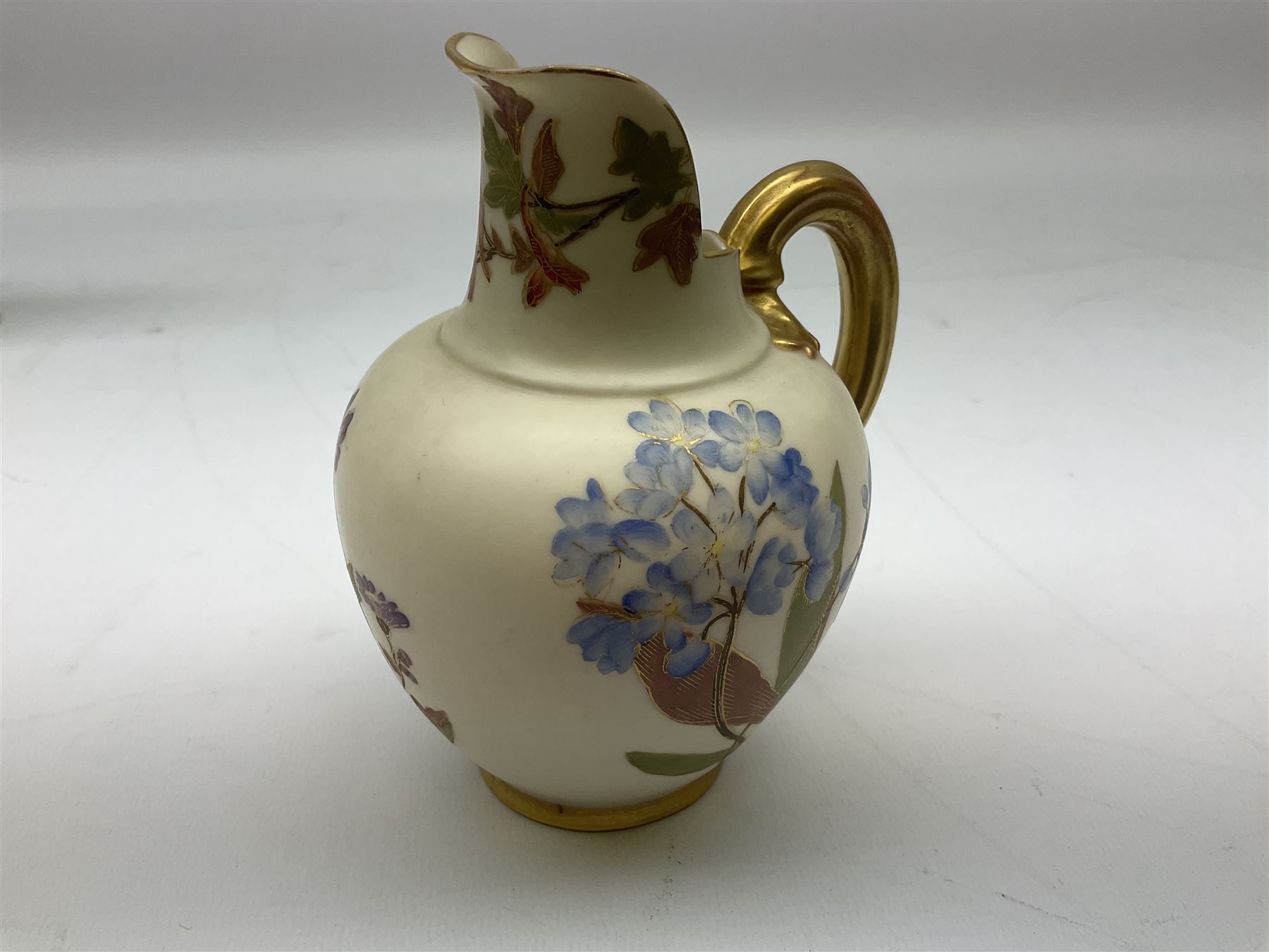 Royal Worcester blush ivory jug of squat lobed form painted with floral