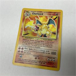 Collection of Pokemon trading cards, mostly 1999 Wizards Pokemon cards to include holo Charizard 4/102, first edition holo Machamp 8/102, further holographic cards; Dark Flareon 35/82 and Dark Vaporeon 45/82, cards from themed sets and 4th edition prints; 1998 Electronic Pokédex with cardboard boxes for themed decks Blackout, Overgrowth and Power Reserve Jungle, along with a large quantity of energy and trainer cards 