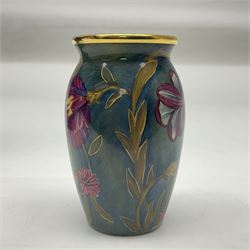 Moorcroft enamel vase, decorated with flowers on a green ground, in fitted box, H7cm