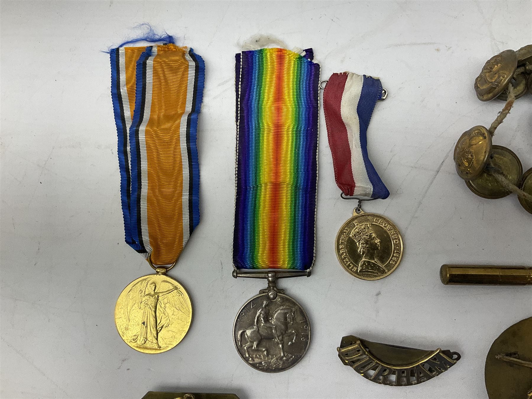 WW1 pair of medals comprising British War Medal and Victory Medal awarded to 24085 Sjt. J. Hazle Durh. L.I.; together with Durham Light Infantry cap and collar badges, shoulder titles, buttons etc; various royalty commemorative medallions etc