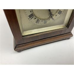 Georgian style mahogany cased bracket type clock retailed by Henry Lee & Sons Hull, with brass carrying handle to the pagoda top, arched silvered dial with Tempus Fugit plaque, raised chapter ring with Roman numerals enclosing French brass eight day movement with integral key, on bun feet, H24cm  