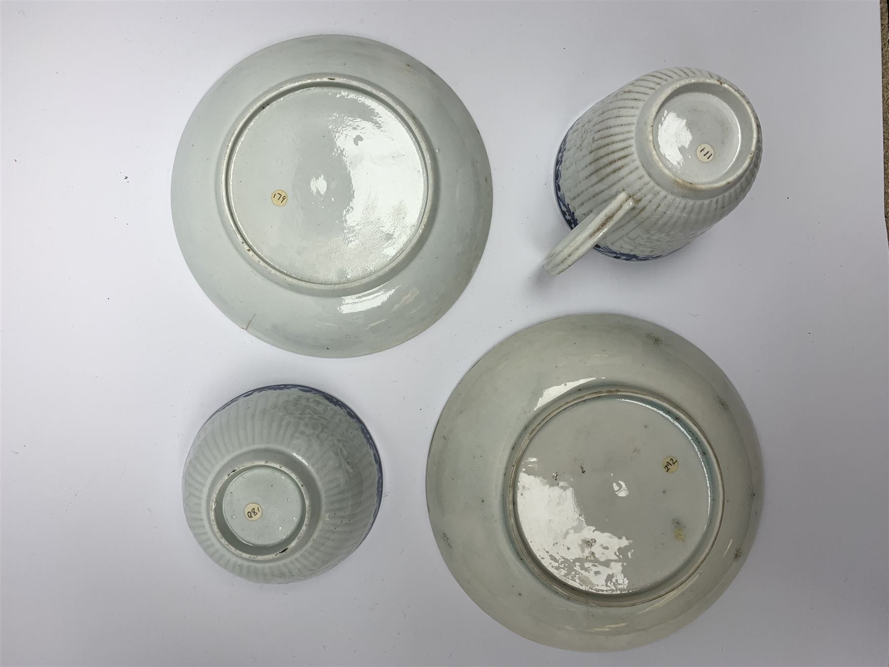 18th century Phillip Christian Liverpool reeded and floral moulded tea wares, comprising coffee pot, tea bowl and saucer, and coffee cup and saucer, each detailed with foliate and trellis borders, teapot H25cm, tea bowl D7.5cm, saucer D13cm 