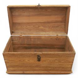 Early 20th century pine coffer, domed lid over plain front and sides with exposed dovetail joints, iron hasp and staple to front