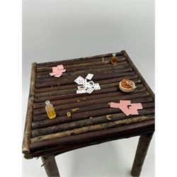 Anthropomorphic Taxidermy: Two red squirrels (Sciurus vulgaris), both seated upon a chair holding playing cards, one smoking a pipe 