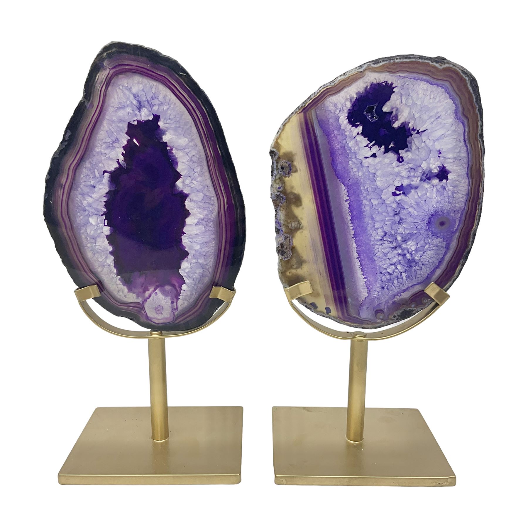 Pair of purple agate slices, polished with rough edges raised upon gilt metal stands
