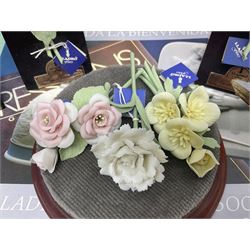 Seven Lladro flowers, comprising Japanese Camelia on base no 5181, Yellow Begonia on base no 5186, Miniature Begonia on base no 5188, Chrysanthemum on base no 5189, California Poppy no 5190.B, Miniature Begonia 5188.B and White Carnation no 5184.B, together with Lladro Spanish Joining pack with 17616 Winter Bell, Additional Lladro parasols and flowers etc 