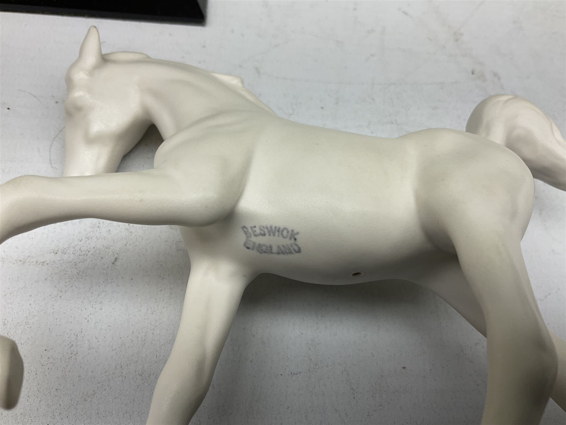 Five Beswick and Royal Doulton horse figures in matt white on black plinths, comprising of  Spirit of Affection no. 2689/2536, Springtime no.2837, Spirit of peace no.2916, Spirit of earth no.2914 and Spirit of the wild no. 183, together with a composite figure of a horse (6)