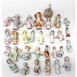  Collection thirty of ceramic pin cushion/ half dolls of varying sizes, including one with pin cushion base, H12cm max   