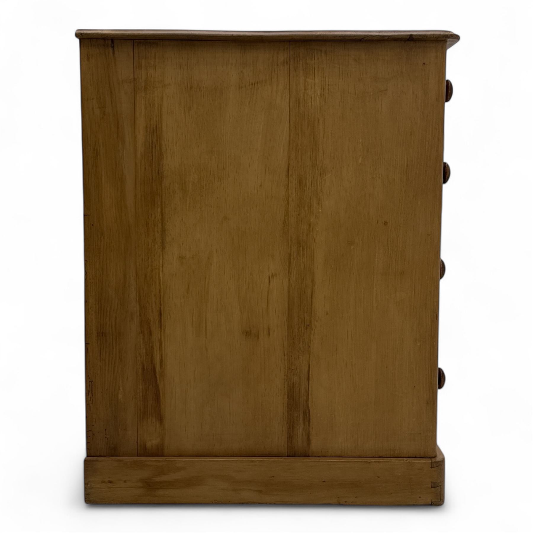 Late 19th-century Victorian stripped pine twin pedestal kneehole dressing table, the rectangular top above three short and three graduated drawers on each pedestal and a central cupboard, on a moulded plinth base 