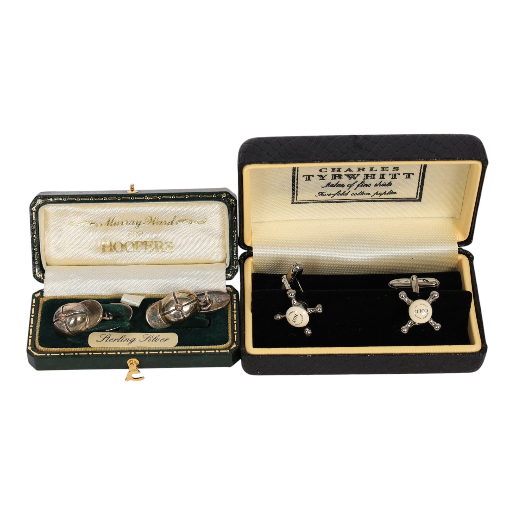 Three pairs of silver cufflinks, comprising jockeys cap pair, Halcyon days teddy bear enamel pair and a 1995 enamel pair, together with two other pairs of novelty cufflinks