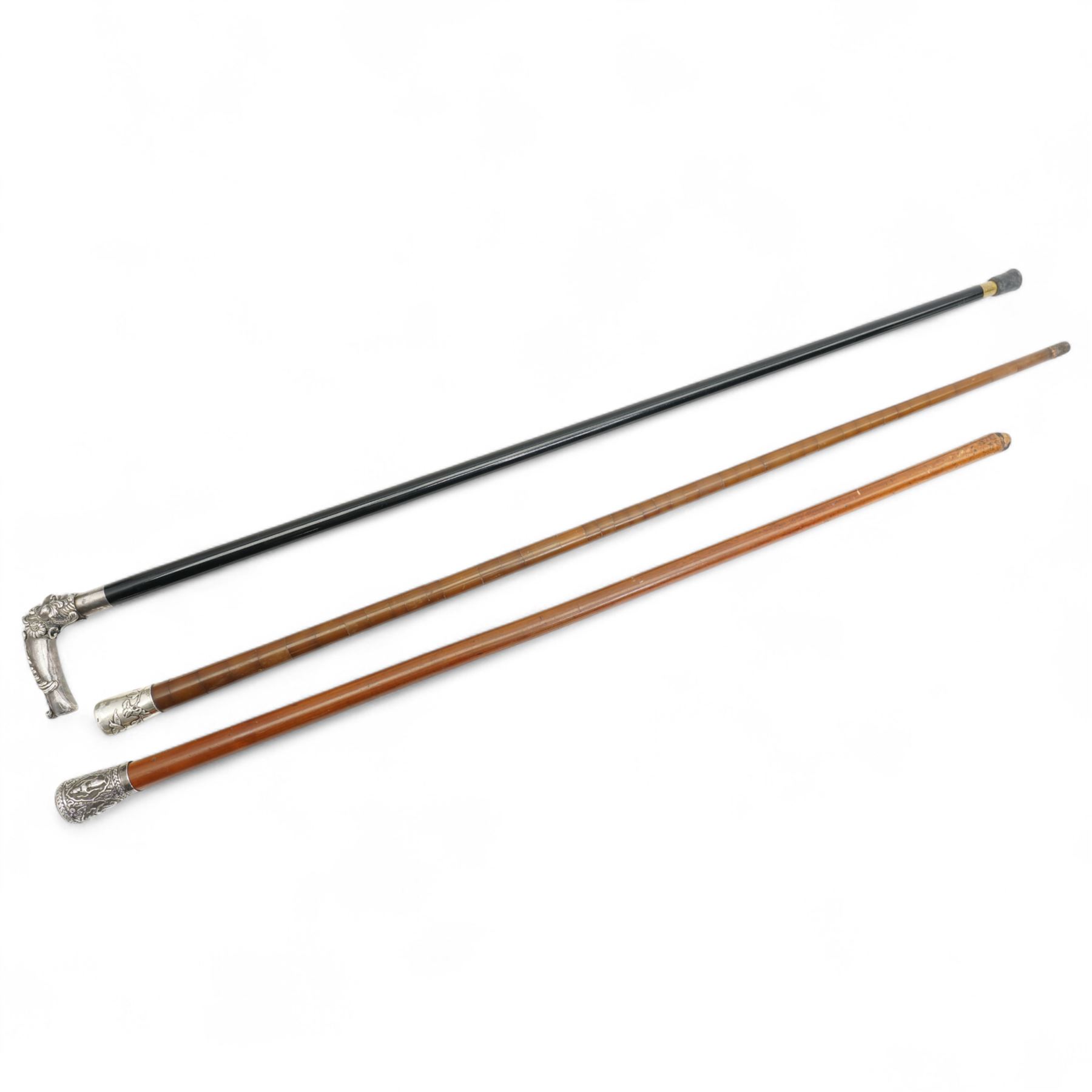 Chinese segmented horn silver mounted cane L89cm, Indian stick and an ebonised evening cane with silvered crook handle