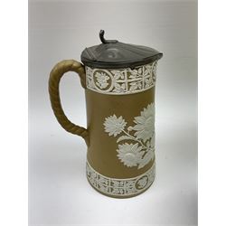 Bursley Ware Charlotte Rhead ginger jar (lacking lid), together with Royal Doulton Prunus pattern jug D3832, Art Deco style jugs, relief moulded jug with pewter lid decorated with flowers etc