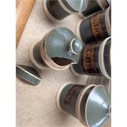 19th century sage green apothecary jars with gilt labels, four white ceramic kitchen jars and a stoneware flaggon marked Wheat Wine