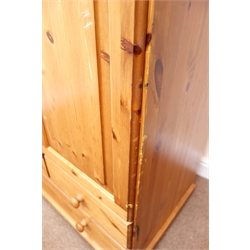  Solid pine double wardrobe, two doors enclosing hanging rail above two short and one long drawer, bun feet, W87cm, H176cm, D52cm  