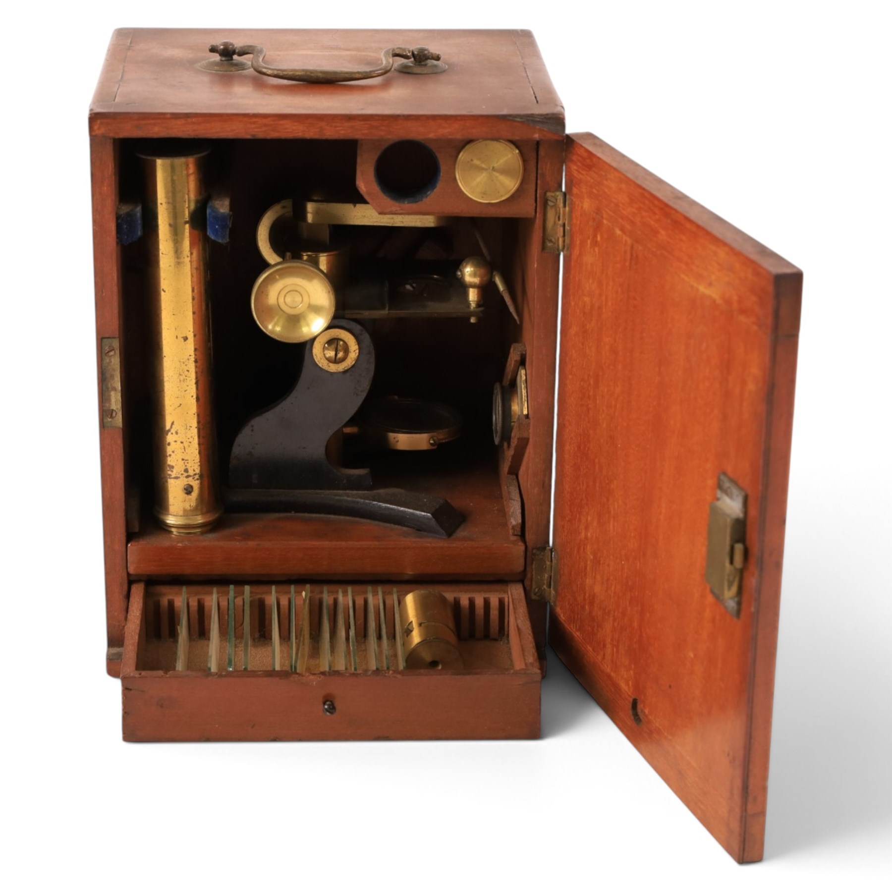 Early 20th century brass microscope, with spare lenses and a small collection of prepared slides, within wooden carry case