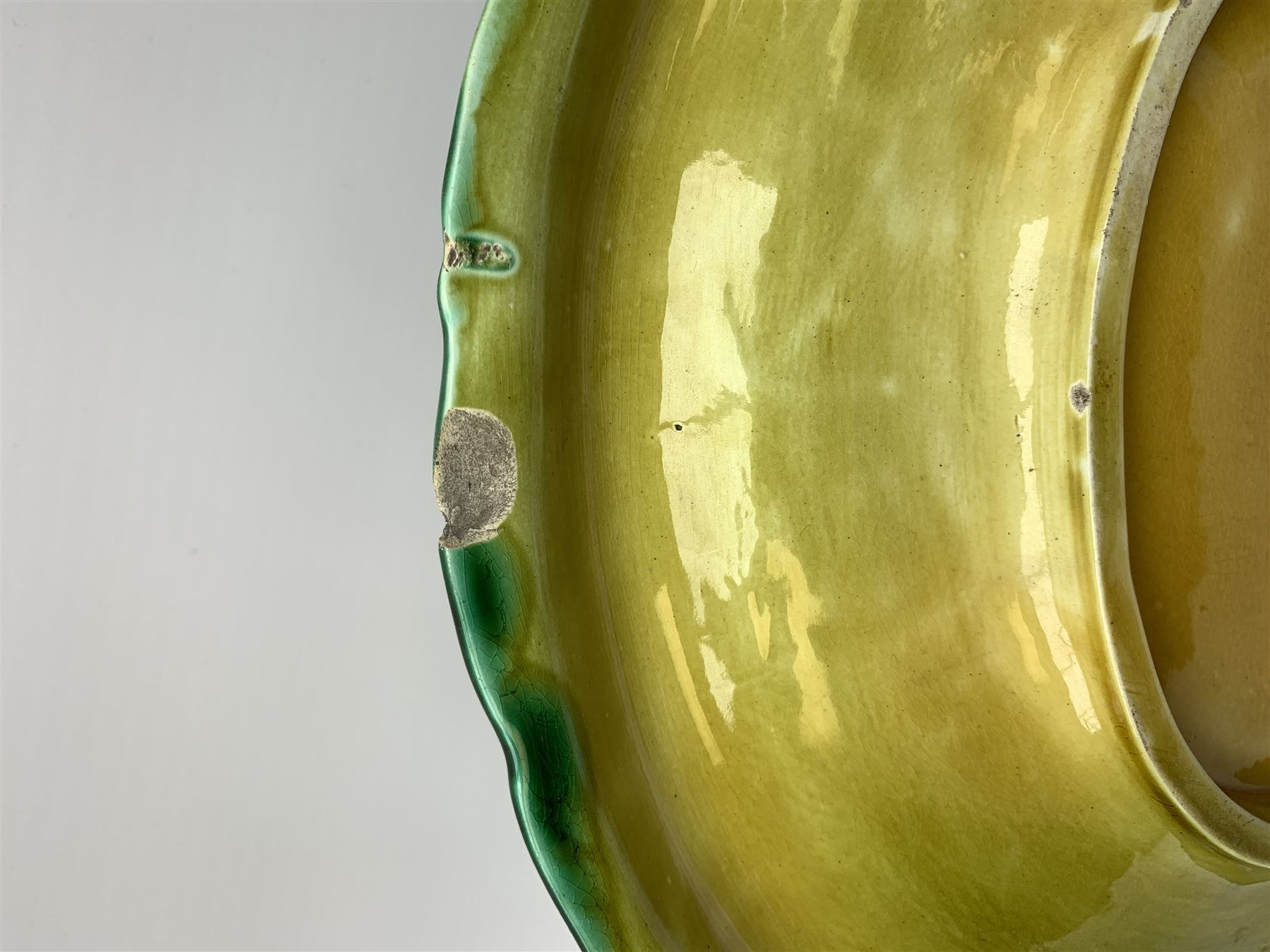 A Victorian majolica bread plate depicting corn within a woven basket, L33cm, together with a Victorian majolica jug modelled in the form of a corn cob, with registration mark beneath, H22cm. 