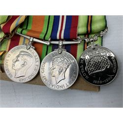 WW2 Royal Naval group of eight medals comprising OBE, hallmarked silver Distinguished Service Cross inscribed verso Lieut. J.R. McCluskie RNVR 1945, 1939-1945 Star, Atlantic Star, Africa Star, 1939-1945 War Medal, Defence Medal and Royal Naval Patrol Service Medal inscribed Lieutenant J.R. McCluskie Royal Naval Patrol Service; with seven original photographs of a sea battle 27th November 1940 against the Italian Fleet and another photographic postcard of Sir Stafford Cripps arriving on board one of the vessels.