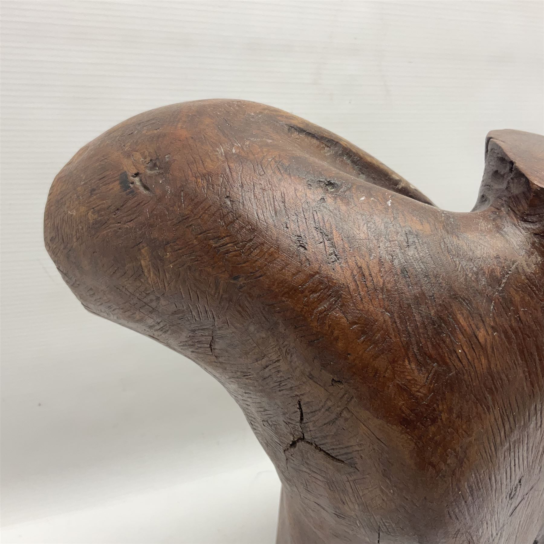 Helen Skelton (British 1933 – 2023): Large carved wooden sculpture, modelled as a male torso, H40cm. Born into an RAF family in 1933 in Kent and travelled the world extensively during her childhood. After settling in Bridlington, Helen immersed herself in painting, textiles, and wood sculpture, often inspired by nature's beauty. Her talent was showcased in a one-woman show at Sewerby Hall and recognised with the sculpture prize at Ferens Art Gallery in 2000. Sadly, Helen’s daughter passed away from cancer in 2005. This loss inspired Helen to donate her sculptures to Marie Curie upon her passing in 2023.