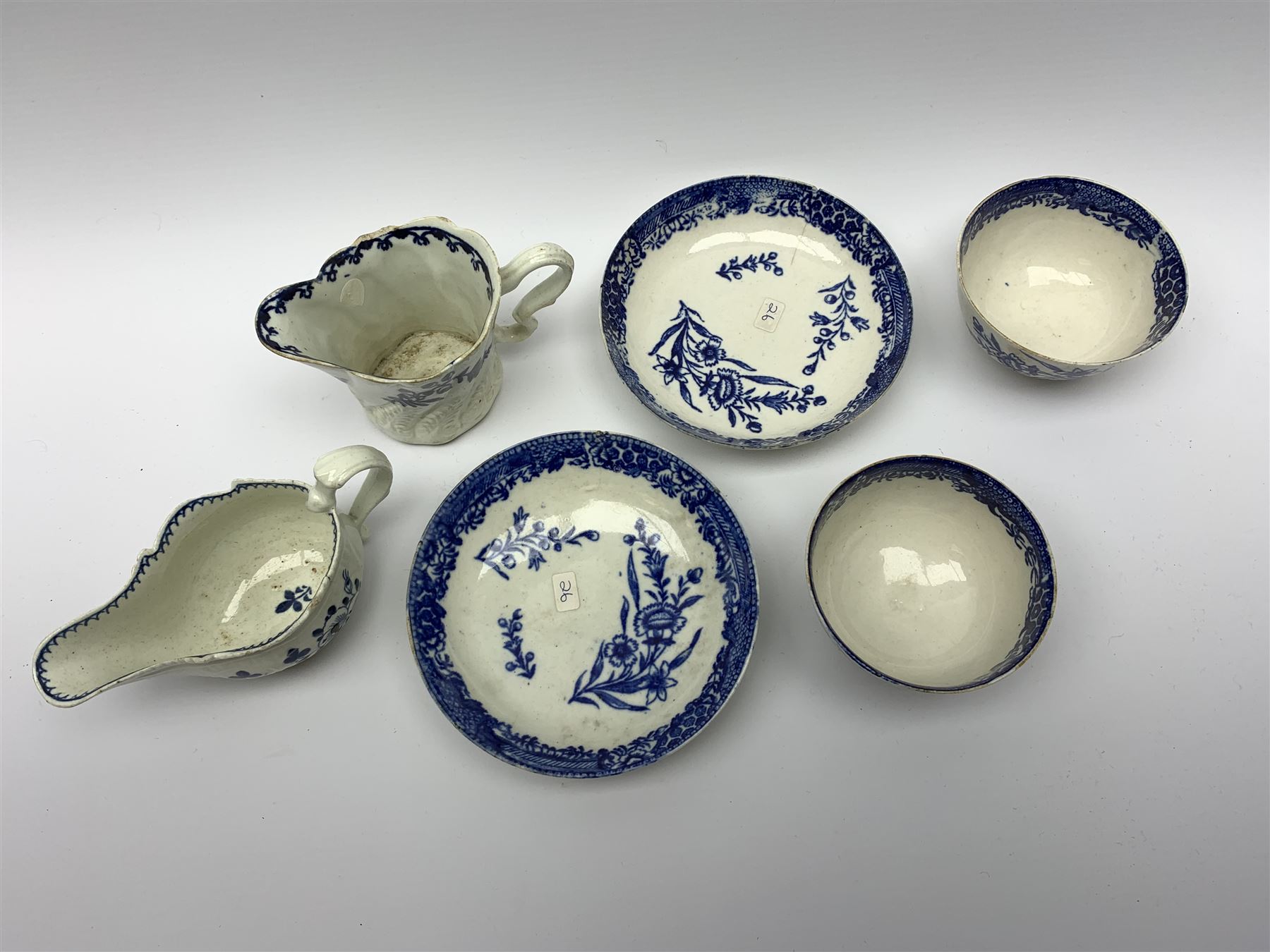 Late 18th century Liverpool Seth Pennington cream jug, H8.5cm, together with another late 18th century example, possibly also Liverpool Seth Pennington, and a pair of late 18th century Liverpool Seth Pennington tea bowls and saucers, saucer D12.5cm, tea bowl D8.5cm, (6)