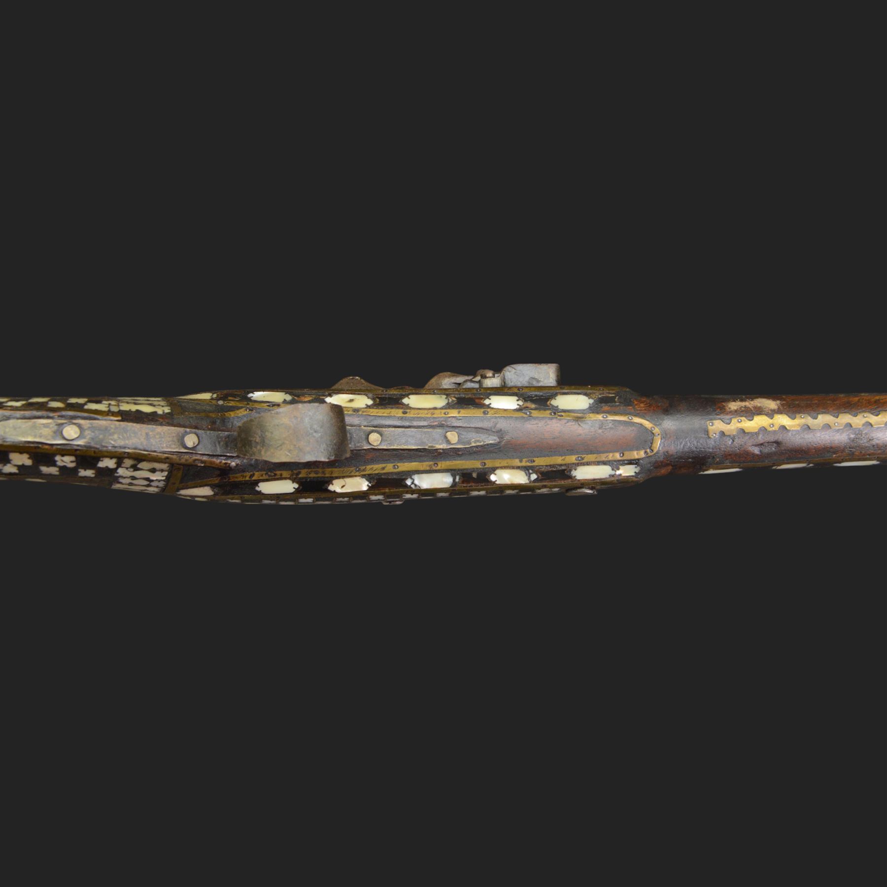 Indian Jezail style flintlock musket, with 118cm barrel, the East India Company lock marked 1818,  the curved butt inlaid with mother of pearl and brass decoration, overall L155cm