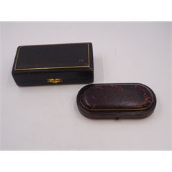 Pair of Victorian silver open salts, of part fluted navette form, with engraved foliate decoration, upon oval stepped foot, hallmarked W H Lyde, Birmingham 1896, H3.5cm, together with a pair of silver salt spoons, with leaf shaped bowls and ball finials, hallmarked Joseph Gloster, Birmingham 1897, together with a pair of Victorian silver open salts, of circular form, with shaped rim and embossed scroll and lattice decoration to the gilded bowl, together with pair of matching silver salt spoons, hallmarked Albert Sydenham, Birmingham 1899, both sets within tooled leather, velvet and silk lined fitted cases