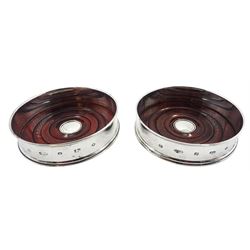 Pair of modern silver mounted bottle coasters, with turned mahogany bases, hallmarked Carr's of Sheffield Ltd, Sheffield 2000, D12.5cm