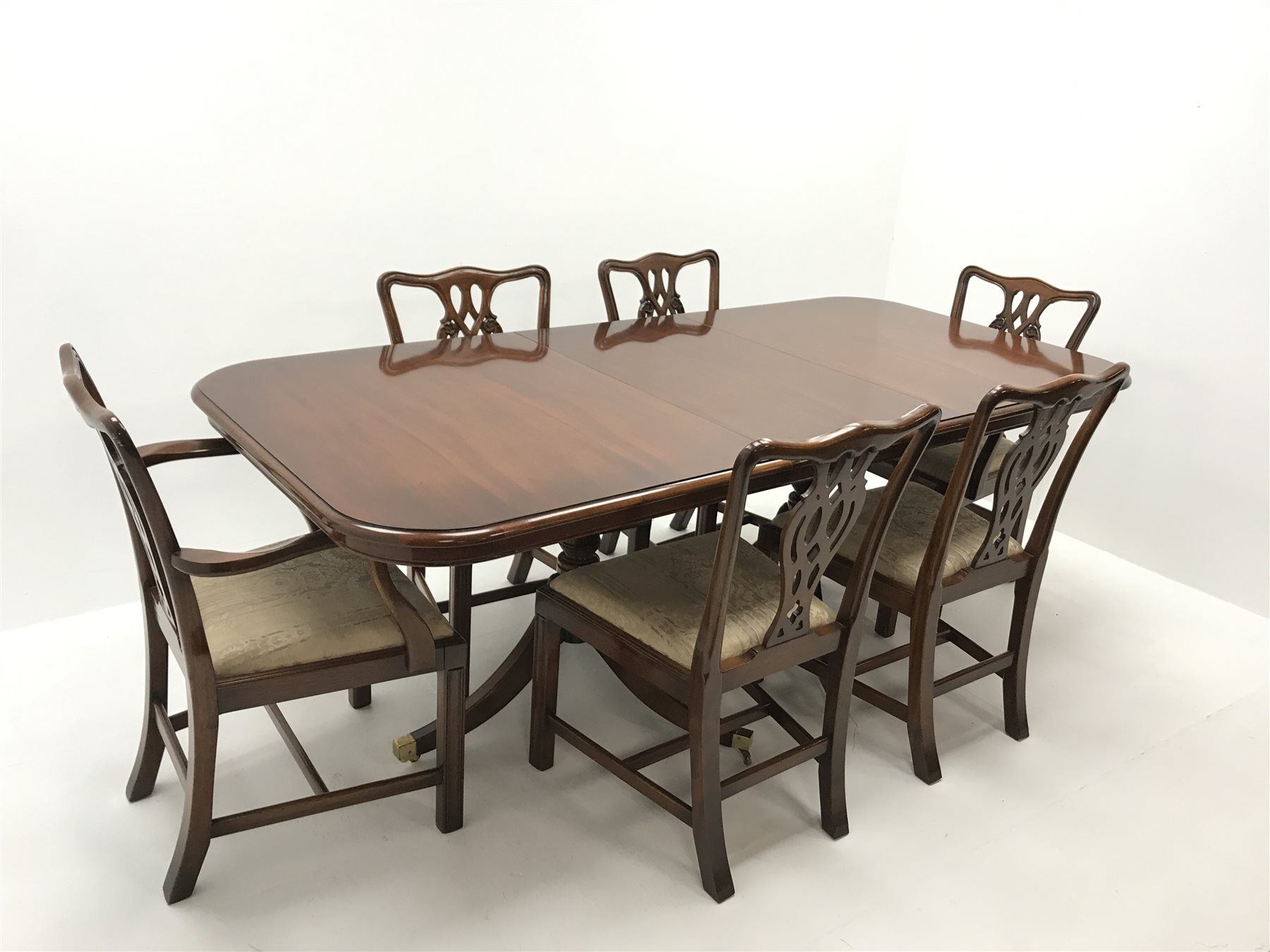 Wade Georgian style mahogany twin pedestal extending dining table, turned supports on shaped brass capped feet (W214cm, H80cm, D100cm) and set six (4+2) Chippendale style chairs, upholstered seat, square supports (W55cm)