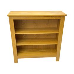 Five light wood open bookcases, four with two adjustable shelves, (W89cm, D29cm, H94cm), one with one adjustable shelf (W89cm, D29cm, H77cm)  