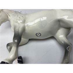 Collection of Beswick horses, including grey horse no.701, palomino foal no 836, grey stocky jogging mare no.855 etc, together two Royal Doulton horses, (8)