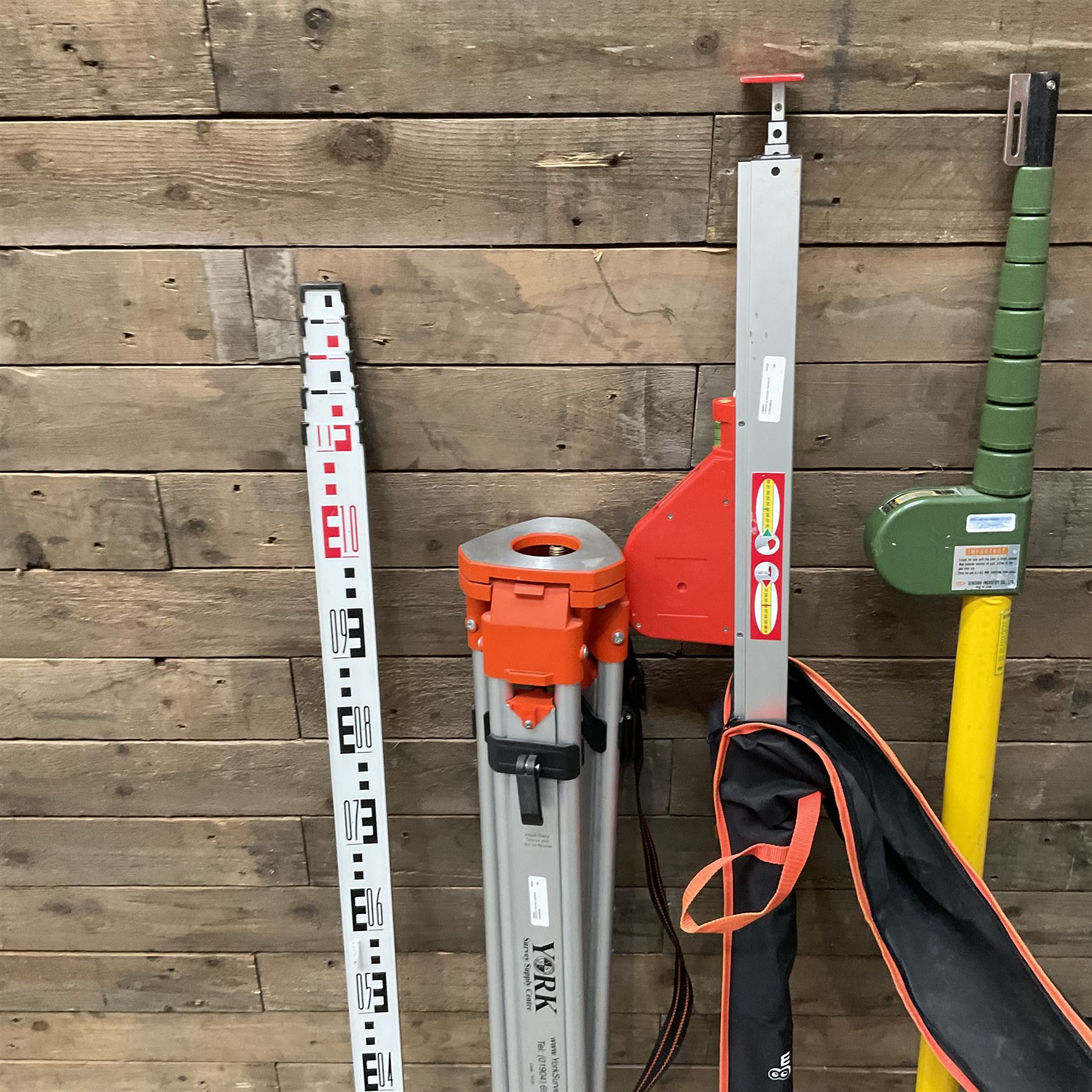 Collection of surveyors equipment including an automatic level and tripod stand and Hilka Pro Craft distance measuring wheel