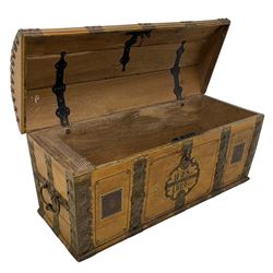 19th century painted oak sea chest, hinged dome top enclosing small compartment, bound by shaped and pressed metal strapwork, scumbled finish to resemble oak and painted with small vignettes depicting portraits and landscapes within panels, fitted with large wrought metal carrying handles, the front inscribed 'H.J.S. 1870' 