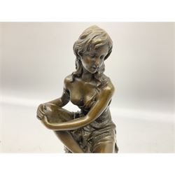 Art Deco style bronze modelled as a female figure, holding her knee, seated upon a chair, after 'Pierre Collinet', H28cm