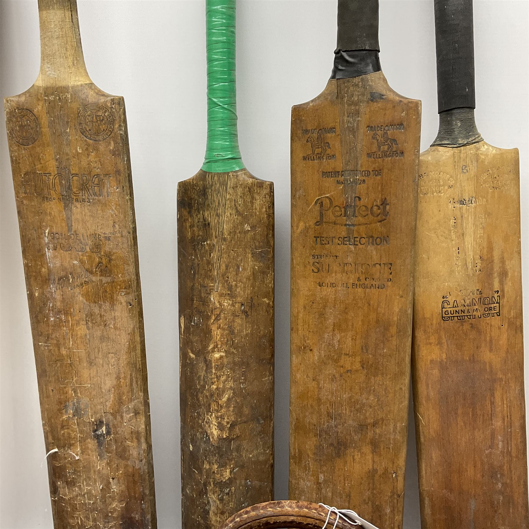 A Vintage leather cricket bag and equipment, to include cricket bats, balls, wickets, and pads. 