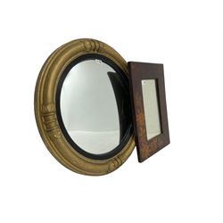 Regency design gilt framed wall mirror, circular convex plate within ebonised reeded slip, the frame with ring turns and applied moulded lappet decoration (63cm x 63cm); Art Nouveau rectangular wall mirror with bevelled plate (53cm x 38cm) (2)