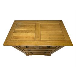 Frank Hudson - contemporary light oak chest, rectangular moulded top over two short and three long drawers, brass oval backplates with circular drop handles, on a moulded plinth base with bracket feet
