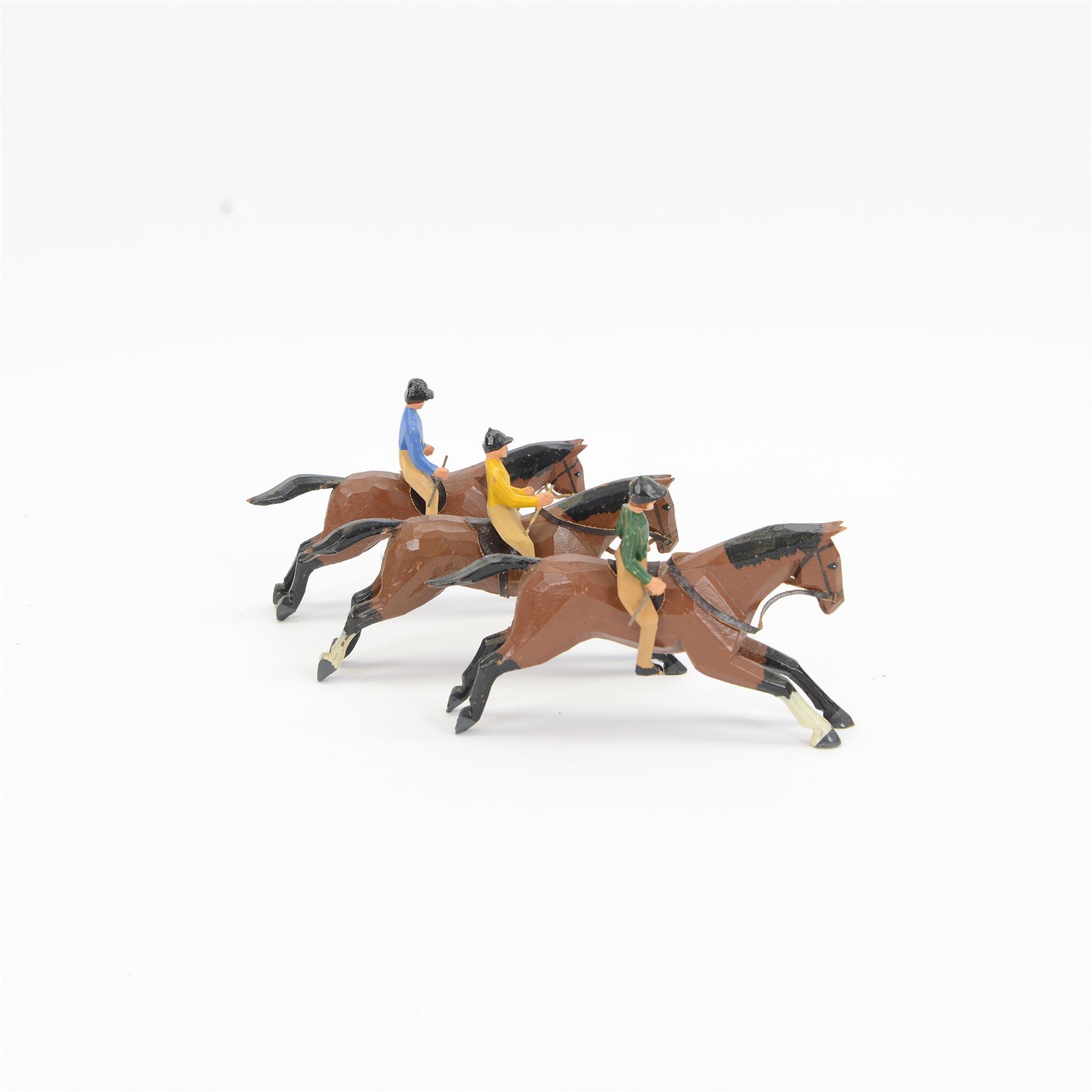 Three early-mid 20th century carved and painted wooden jockeys on horseback, attributed to Frank Whittington of Forest Toys, Brokenhurst