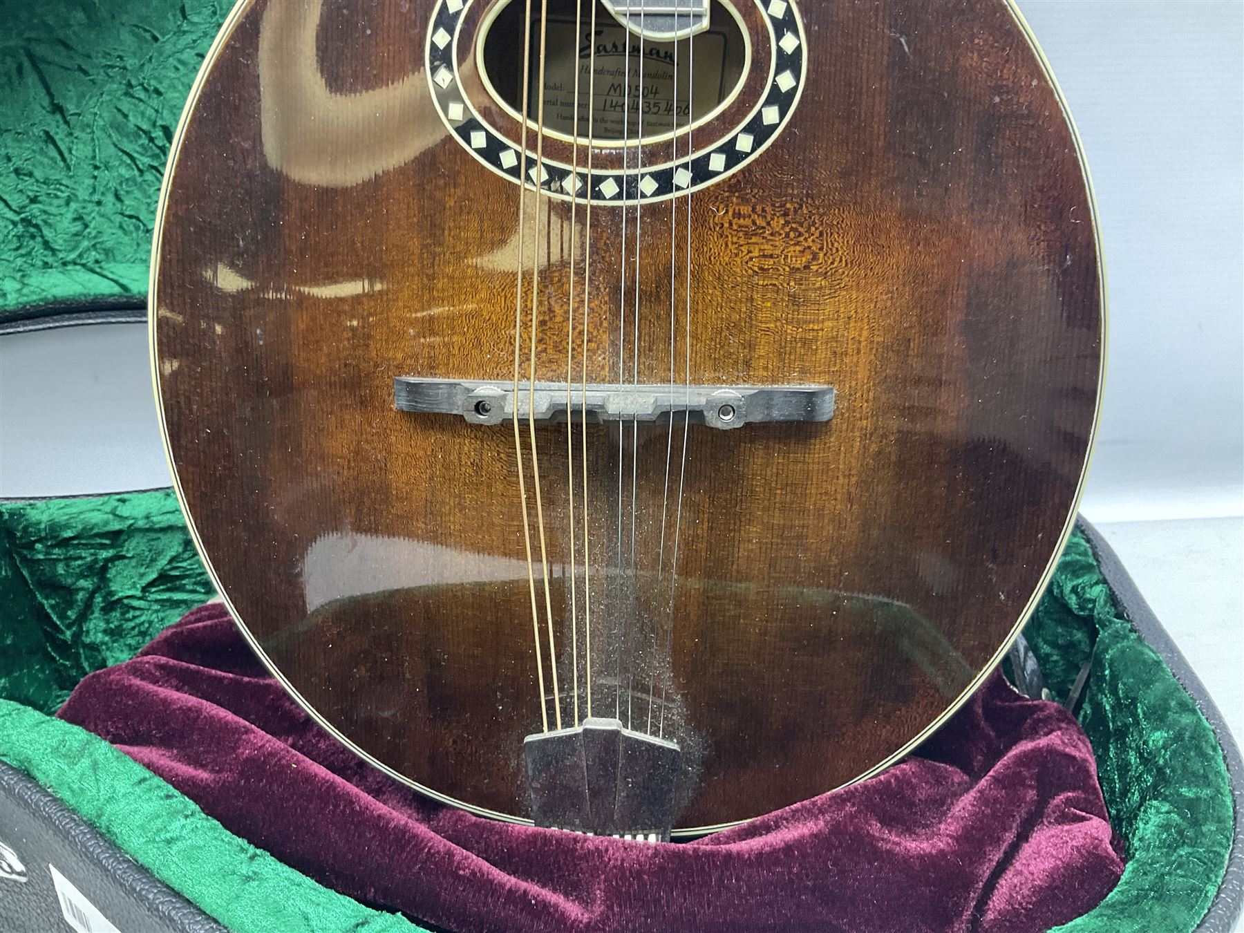 Eastman eight-string mandolin model MD504, serial no.140435406, L66cm; in TGI hard carrying case; together with case of instructional CDs