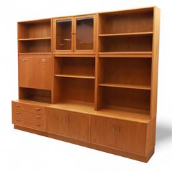 G Plan - Mid 20th century teak sectional wall cabinet, comprising six modular units including a fall front bureau, glazed display cabinet, open bookcase, cupboard and drawer bases, each with recessed handles and flush plinths